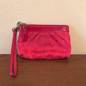 Bright pink Coach wristlet